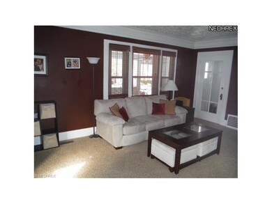 Formal living room has spectacular crown molding, 