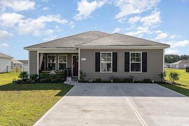 View of front of property with fence, a porch, and