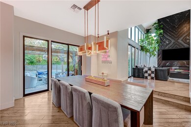Dining room with baseboards, light wood finished f