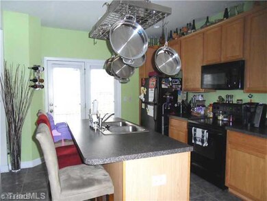 Kitchen. Kitchen with black appliances and island perfect to grab a quick meal.