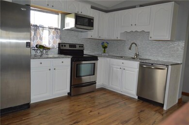 White Cabinets, Hard Flooring and Great Applicance