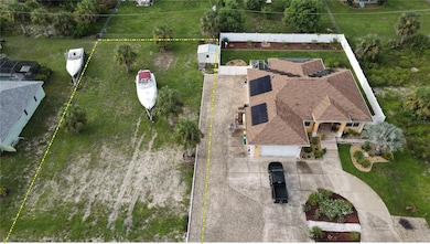 View of House and Adjacent Cleared lot