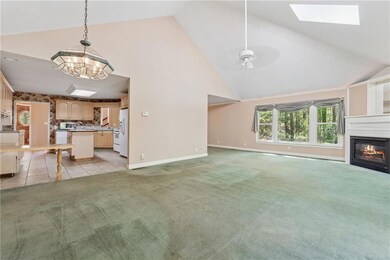 Unfurnished living room with baseboards, ceiling f