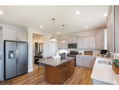 The kitchen is perfect for the gourmet chef and for entertaining, with stylish slate appliances and beautiful quartz countertops. (model photo)