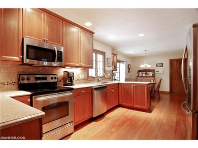 Upscale kitchen has been freshly remodeled with gl