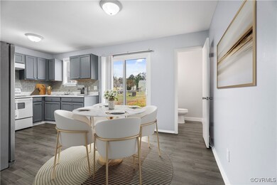 Kitchen with backsplash, sink, electric range, gray cabinets, and dark hardwood / wood-style flooring