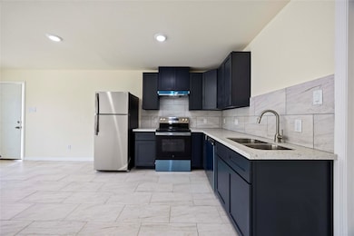 Fresh, bright, and inviting. This kitchen and livi