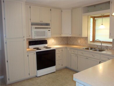 Bead board, ceramic tile backsplash, glass blocks.