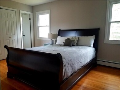The large upper level master bedroom, features two