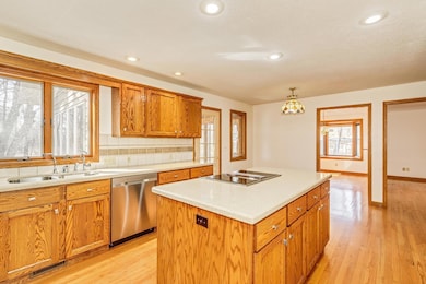 The generously-sized Kitchen offers great cabinet storage and counter space.The abundance of windows and open layout give this home a bright and open feel. There's an informal dining room also. The large center island offers additional storage.