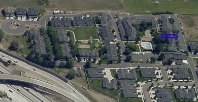 Aerial view of property's location with nearby suburban area
