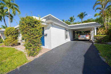 View of side of property featuring a carport