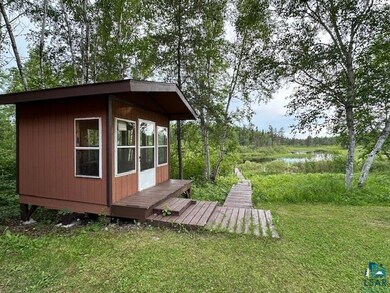 View of outdoor structure with a lawn