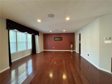 Living room with electric fireplace.