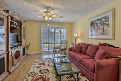 Family room is bright and cheerful with tons of na