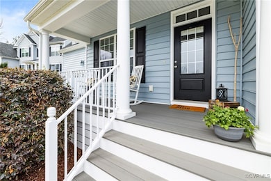 The country front porch has trek floorig and aluminum rails