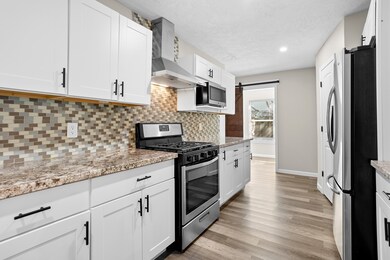 Plenty of cabinets for storage and gorgeos backsplash