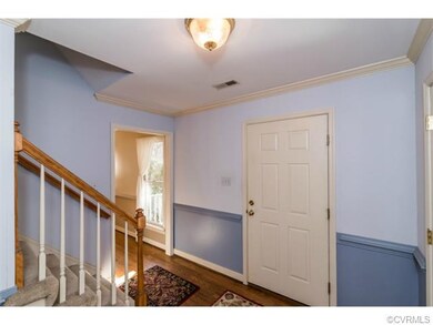 Foyer with hardwood floors