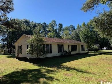 View of front of property featuring a front lawn