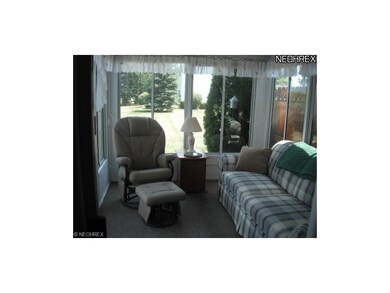 sun room all enclosed with sliders to deck.
