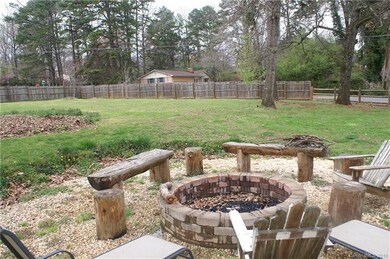 Large fire pit for entertaining with a large garde