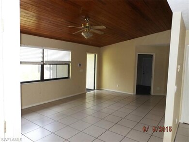 Living Area with Cathedral Ceiling accented in Woo