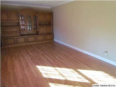 Family room with hardwoods and German bookshelf