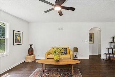 The arched doorway leads to the 2 bedrooms on the first floor.