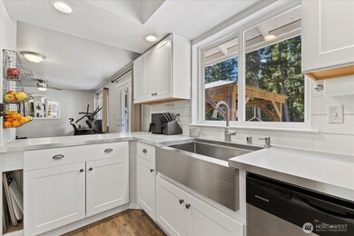 Newer Timeless white cabinets.