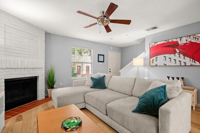 Living area featuring visible vents, wood finishe