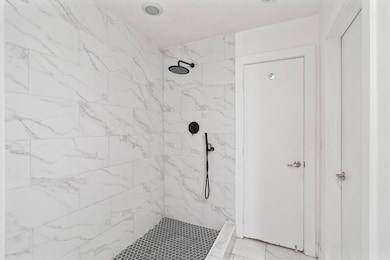 Bathroom with a tile shower