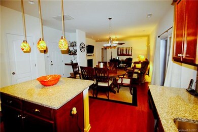 Open floor plan.  Kitchen flows to huge eat-in area and family room w/ gas fireplace.  Notice planning desk/bar area to left.