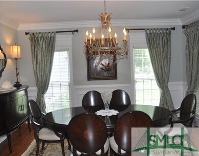 Dining Room. Elegant formal dining room to your ri