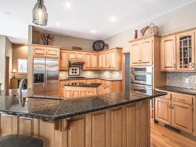 Kitchen features granite counter tops, SS applianc