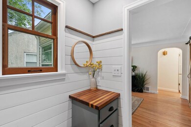 Completely remodeled front entry with bench and cabinet for storage!