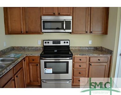 Kitchen. Stainless steel appliances and raised-pan