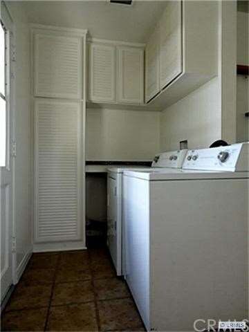 laundry room with plenty of storage