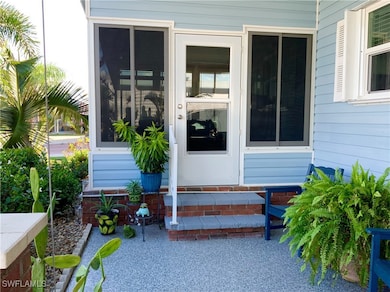 Front Entrance  thru Glass Enclosed Sunroom