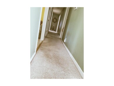 Central Hallway, opening to four bedrooms, bath an