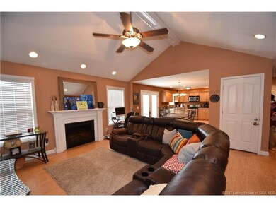 Living room opens to the dining area and kitchen. 