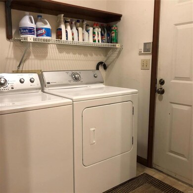 Main floor laundry room, exits to 2-car garage.