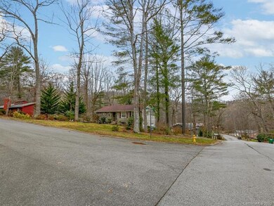 Large corner lot with mature landscaping; concrete