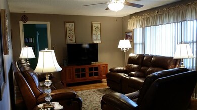 Large living room with natural hardwood floors!