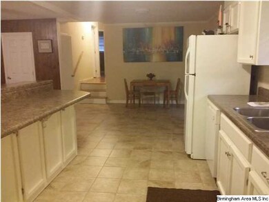 Kitchen / dining area.  Plenty of storage under th