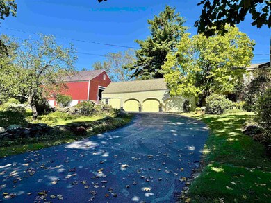 Historic barn sits just behind the house.