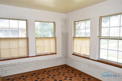 Features tile floor and a ceiling fan