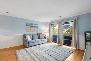 Living room featuring a textured ceiling, visible 