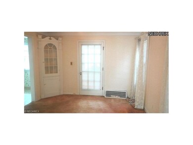 FORMAL DINING ROOM PAINED DOOR LEADS TO ENCLOSED S