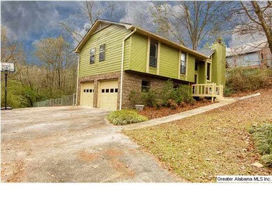 Side view of home with two-car garage.