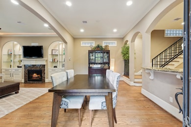 Bright, open-concept dining and living area featur